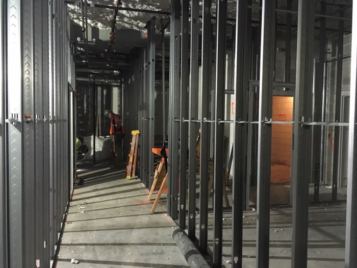 Close-up of light-gauge metal stud framing for an interior partition wall